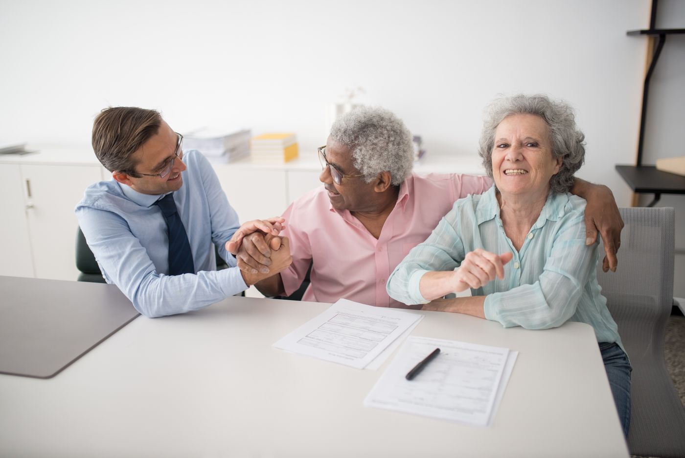 Licensed United Liberty agent reviewing health coverage options with a happy couple